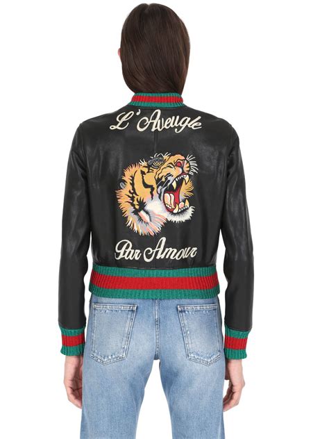 gucci leather jacket with tiger|Gucci denim jacket with embroideries.